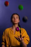 Young woman juggling.
